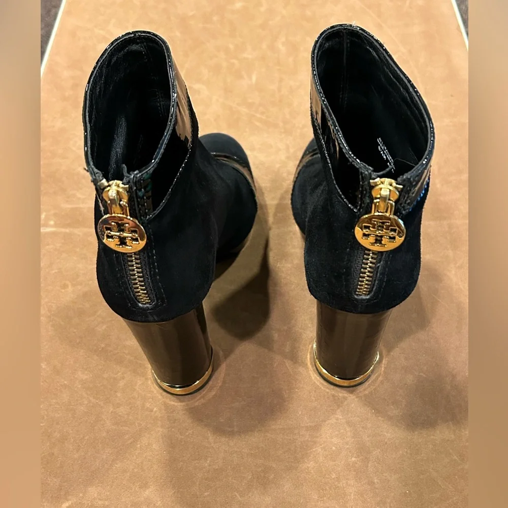 Tory Burch women’s black suede ankle boot with black leather and gold tr…